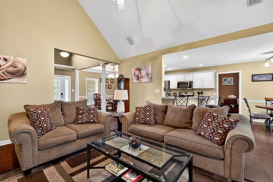 Living Room: Relax in this cozy Airbnb living room featuring a comfortable seating area and a smart TV, perfect for unwinding after a long day.