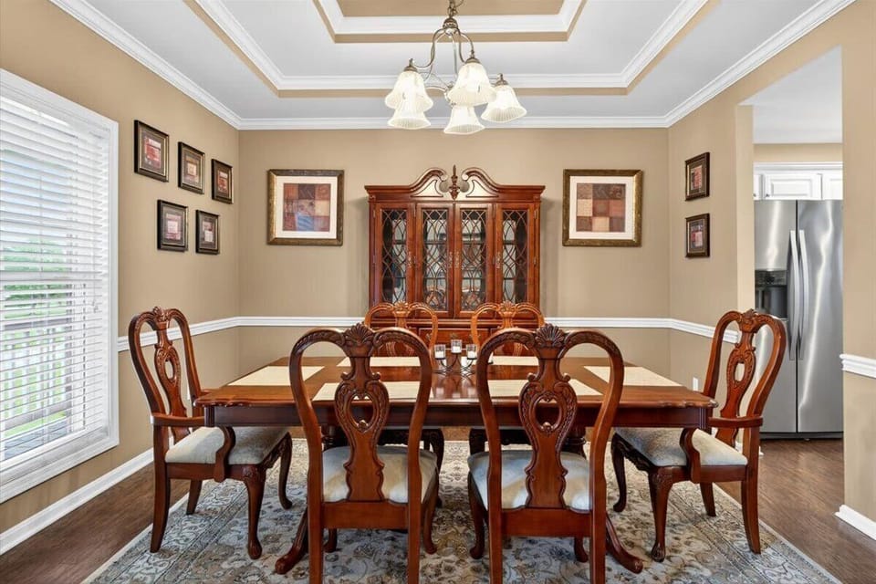Dining Area: Gather and enjoy meals in this inviting dining area, designed for comfort and connection with a warm and welcoming atmosphere.