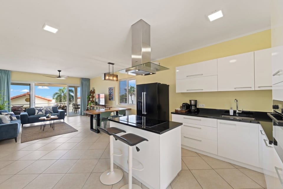 Fully equipped modern kitchen with stainless steel appliances and ample space for cooking and entertaining