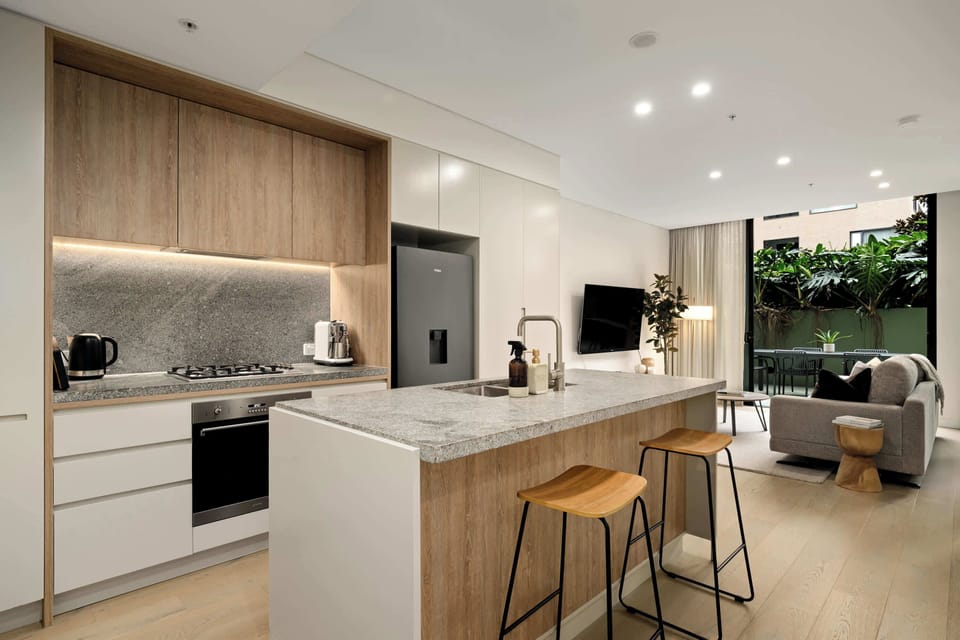 Modern, fully equipped kitchen with island seating. 