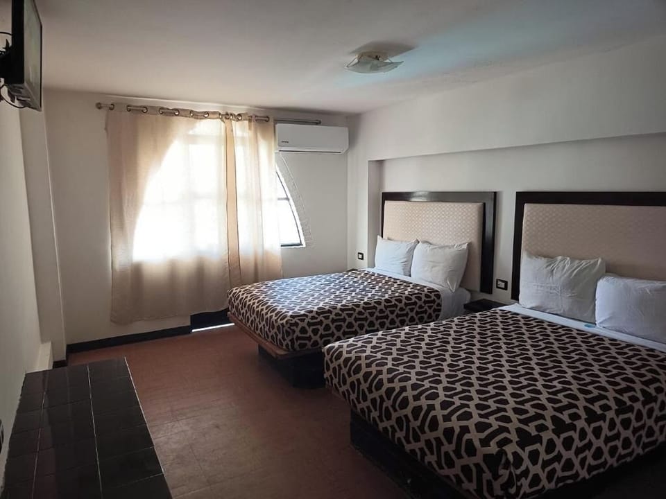 Unwind in a bright double-room with cool, quiet AC.