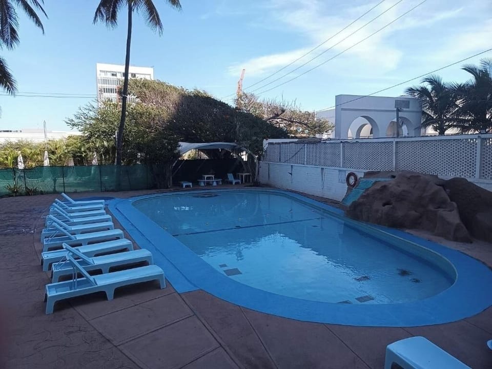 Stretch out on sun loungers for an easy pool day.
