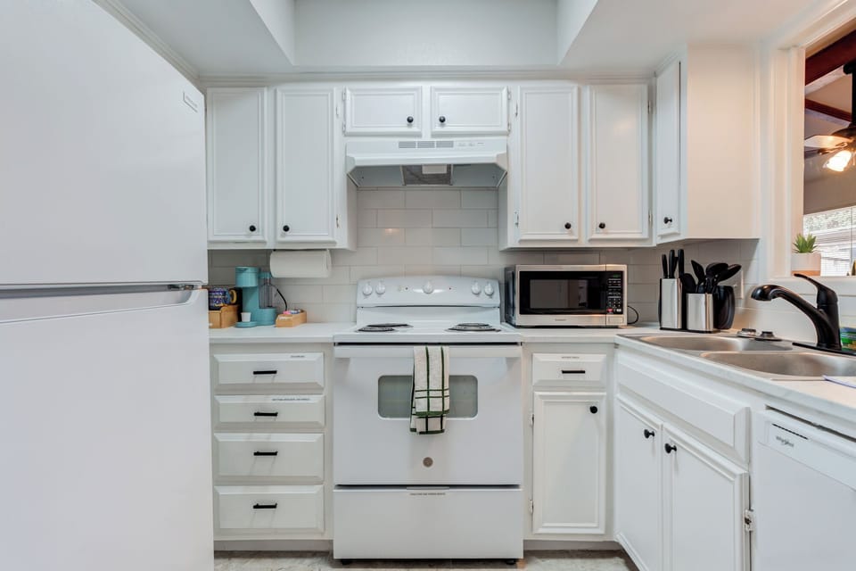Plenty of counter space for meal prep and a double-basin sink for easy cleanup.