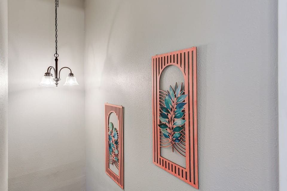 Unique, laser-cut wall art adds a pop of color and personality