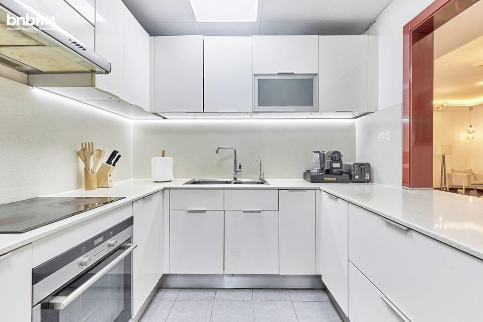 Deluxe Apartment, Partial Sea View | Private kitchen | Espresso maker, coffee/tea maker