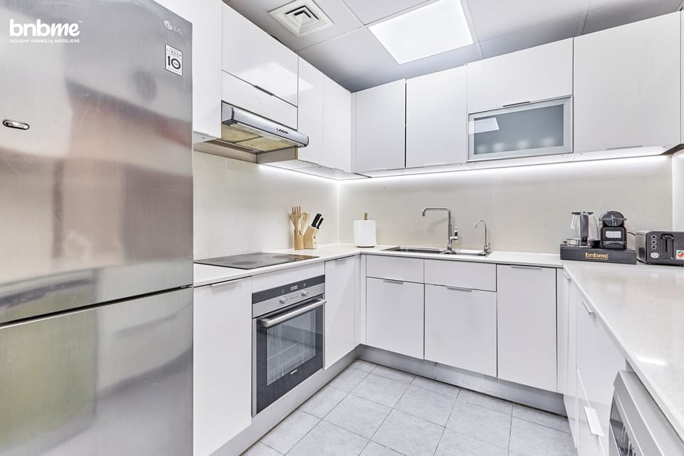 Deluxe Apartment, Partial Sea View | Private kitchen | Espresso maker, coffee/tea maker