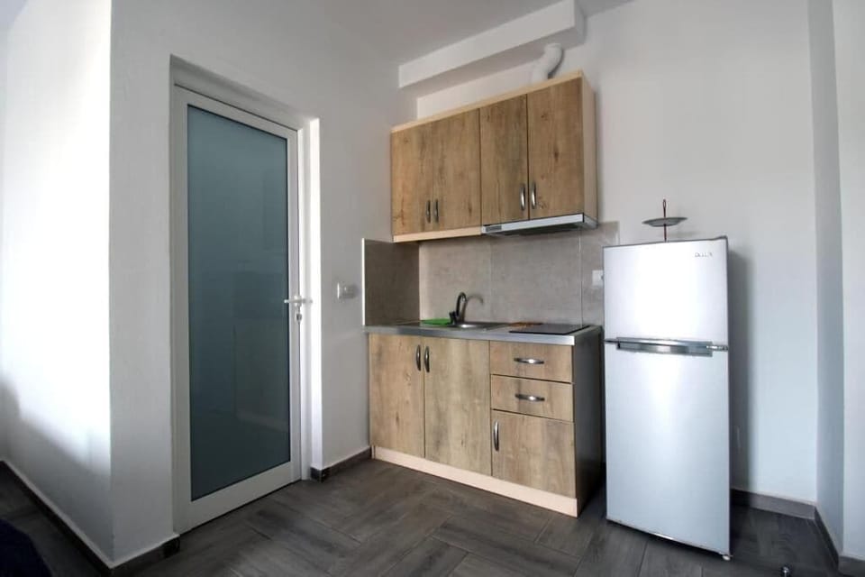 Family Studio, Balcony, City View | Private kitchen | Fridge