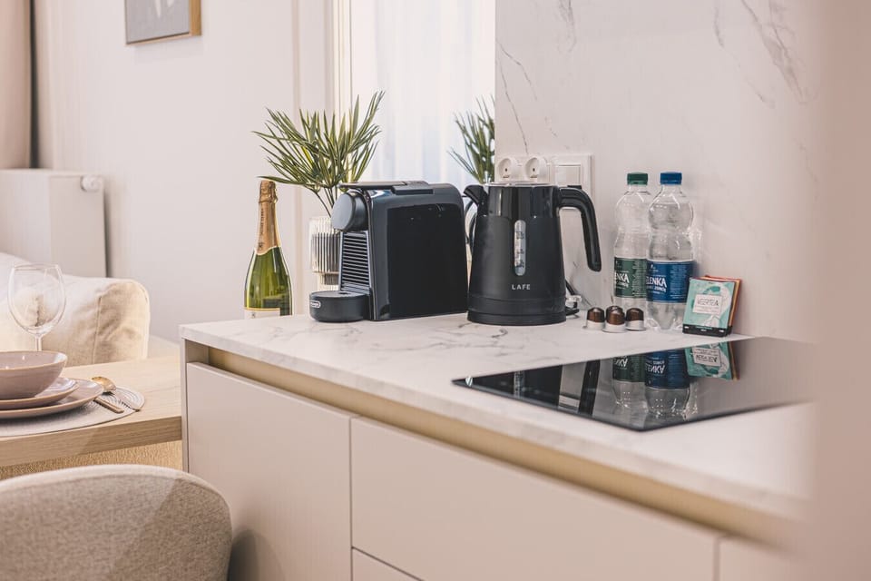 Extra amenities like a coffee machine add comfort to your stay in central Bydgoszcz.