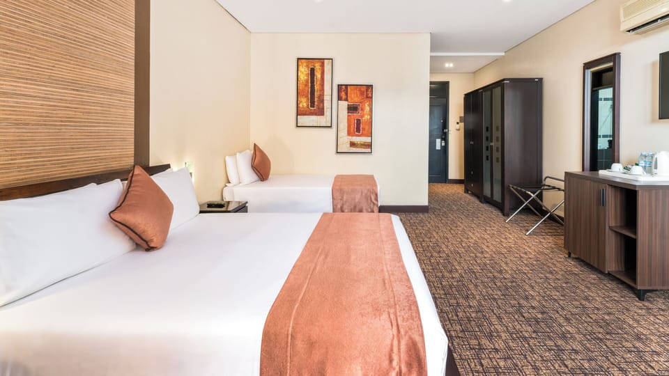 Standard Twin Room, Balcony, City View | In-room safe, desk, laptop workspace, iron/ironing board