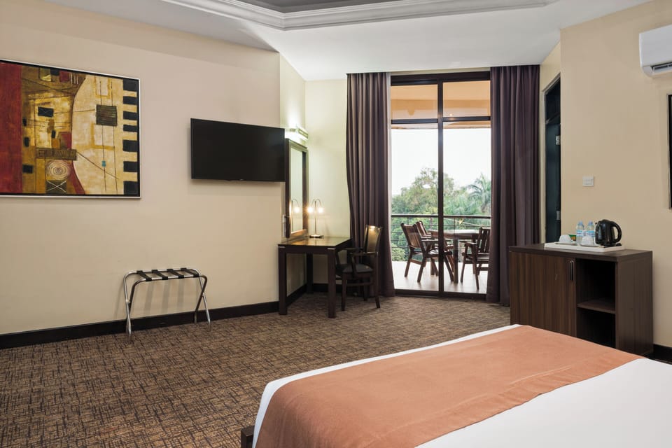 Standard Room, Balcony, City View | In-room safe, desk, laptop workspace, iron/ironing board
