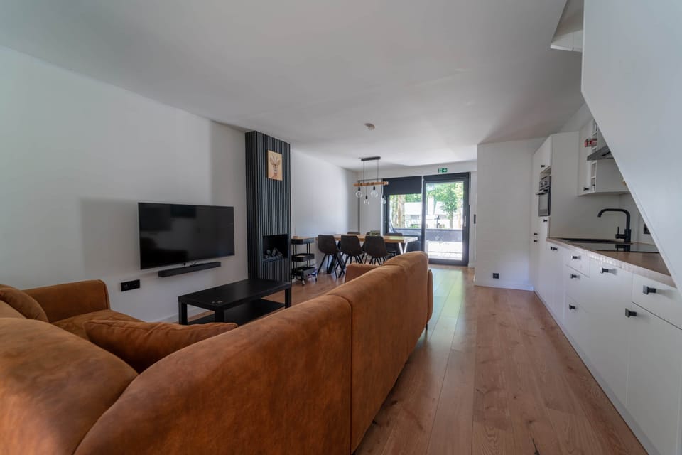 Living room, side view, kitchen in the background