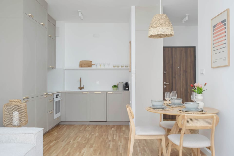 Open kitchenette and dining space with modern finishes.