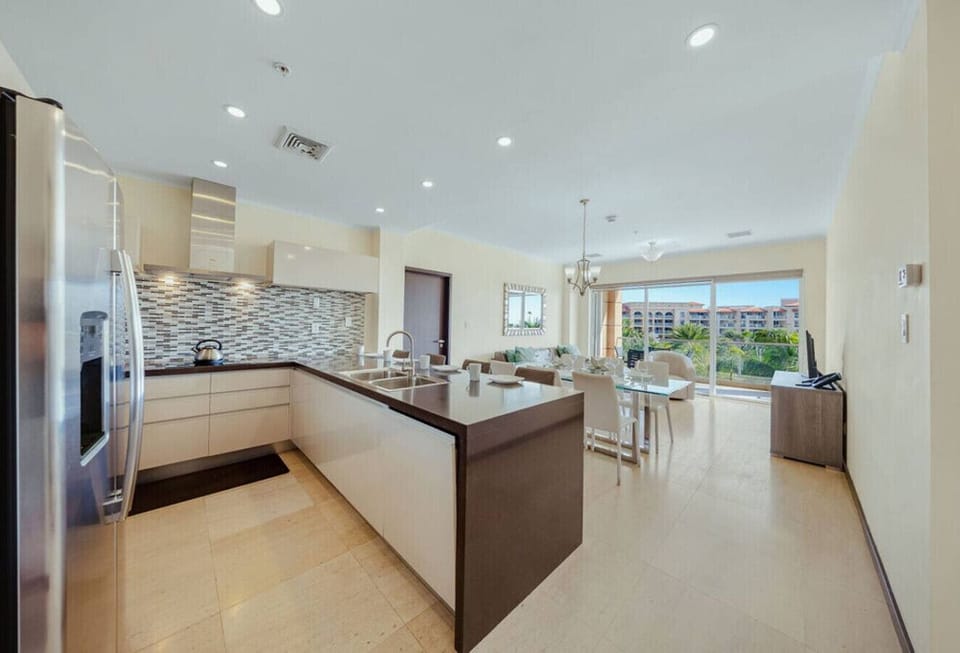 Spacious open layout connecting kitchen, dining, and living area—plenty of room to cook, dine, and relax together.