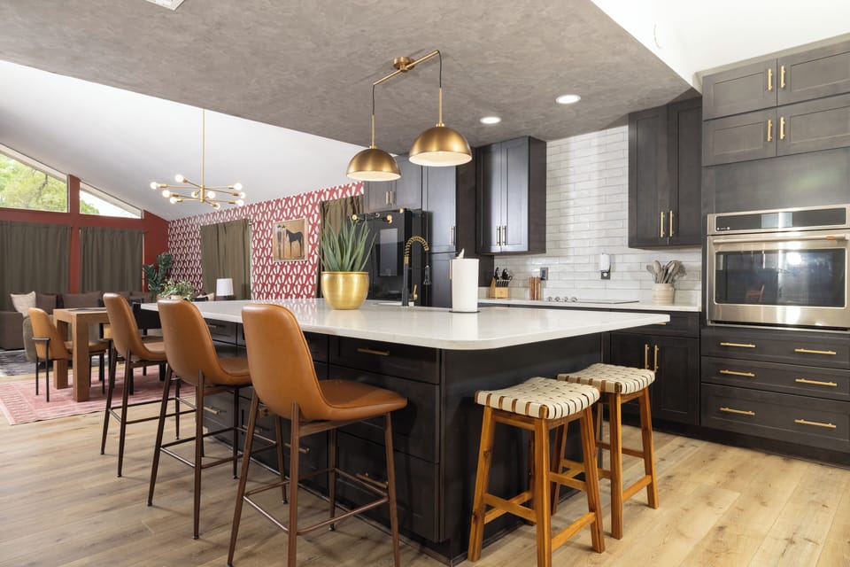 Spacious kitchen with large island and bar seating — a central spot for meals, conversation, and gathering together