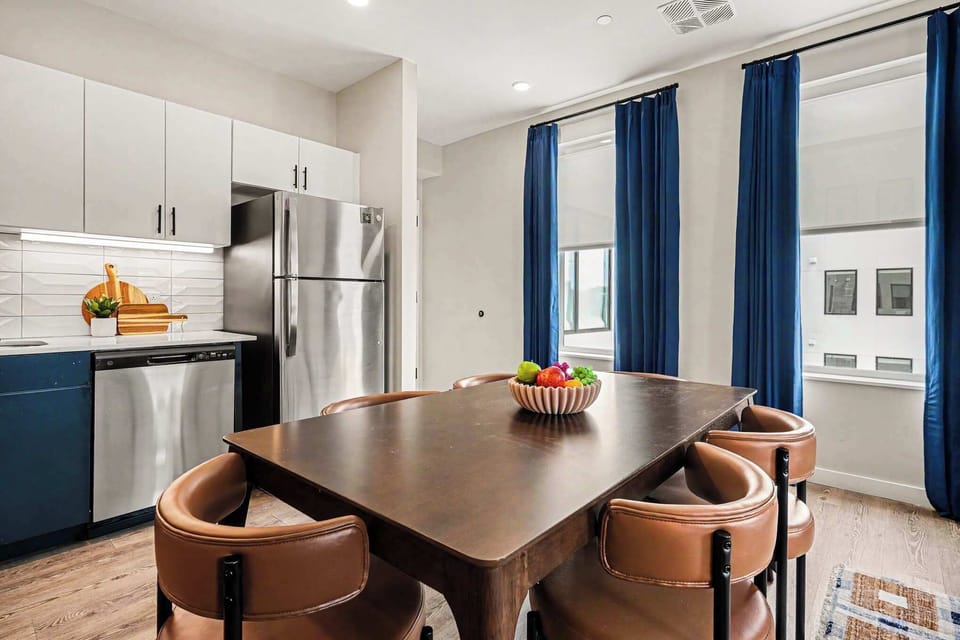 This modern kitchen features sleek stainless steel appliances, dining area for 6, and all the essentials you need for a comfortable and convenient stay. Open concept to living area. 
