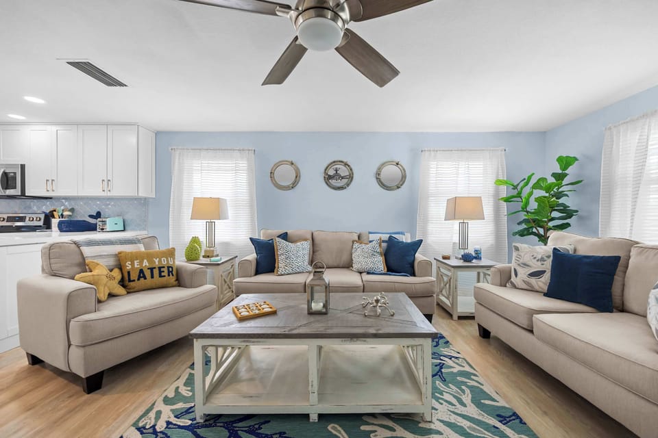 Enough seating for the whole crew. Porthole mirrors, coastal touches, and room to actually relax.