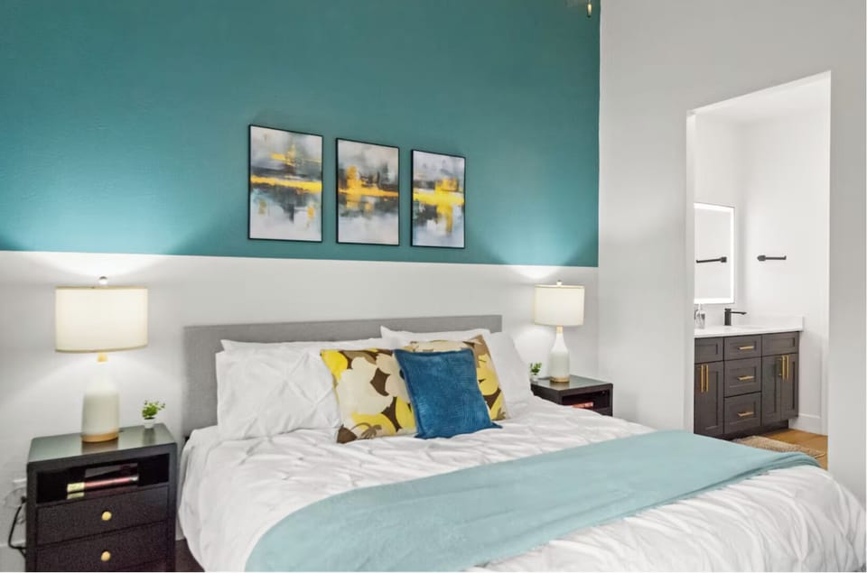 Serene bedroom with soft textures, calming colors, and natural light.