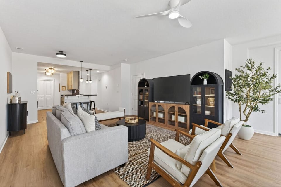 This bright, beautifully designed open-concept living area gives everyone room to spread out—perfect for movie nights, morning coffee, and making vacation memories together.