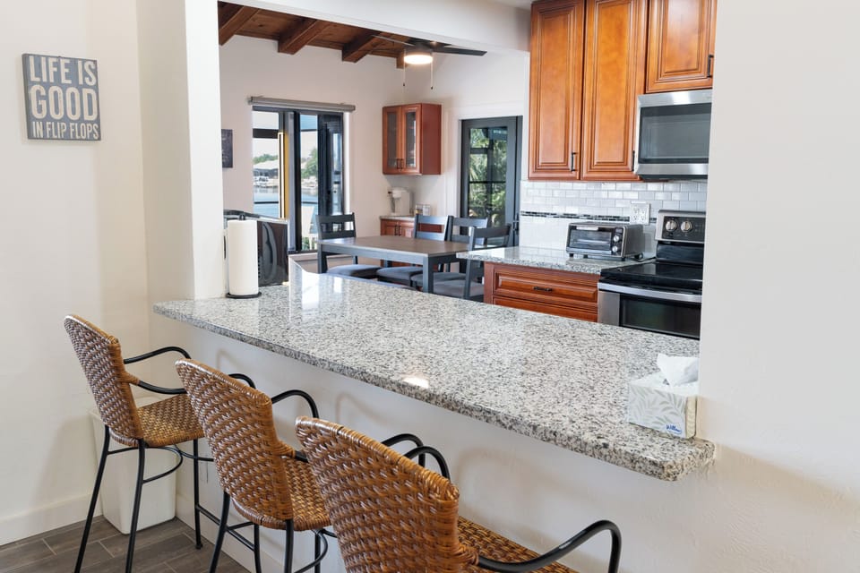 Cook, eat, repeat in this well-stocked full kitchen w/ bar seating.
