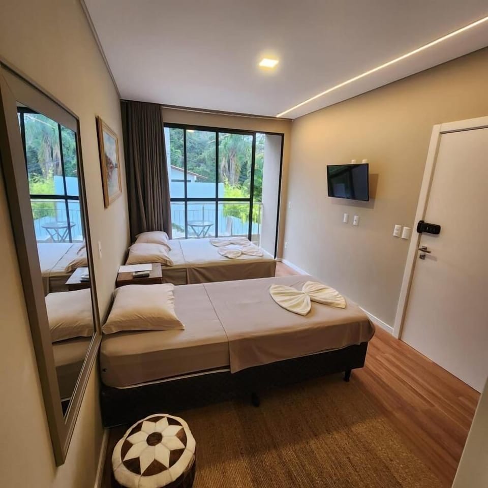 Standard Triple Room, Balcony, Partial Ocean View | Soundproofing, WiFi (free), individually decorated