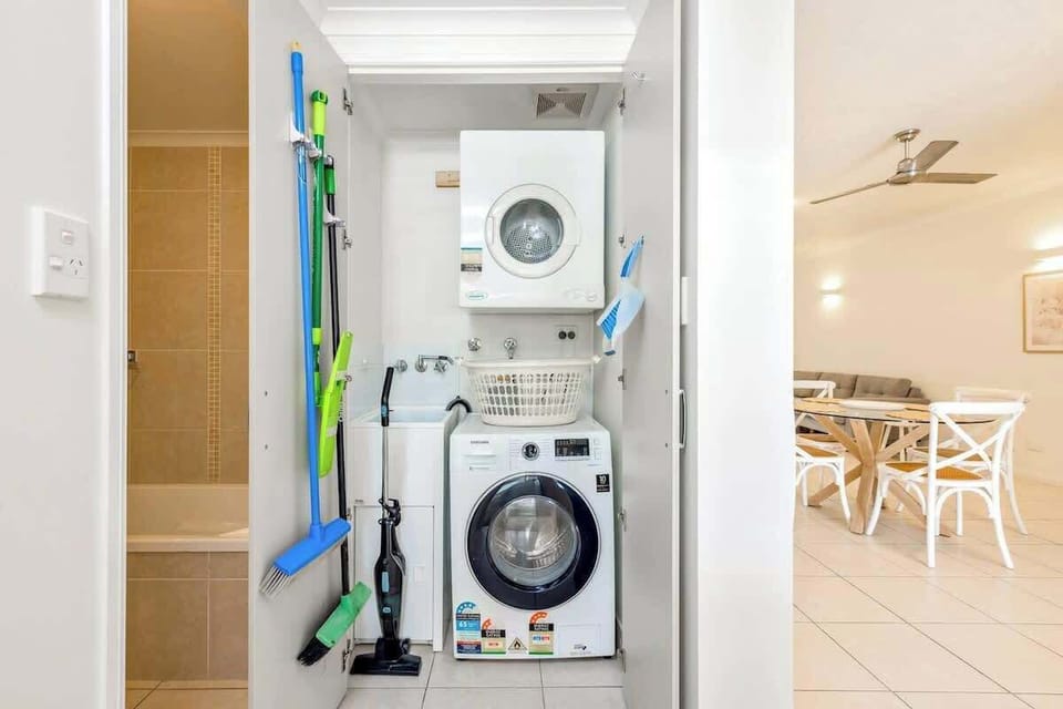 The laundry room includes a washing machine and a dryer, adding to your everyday convenience.