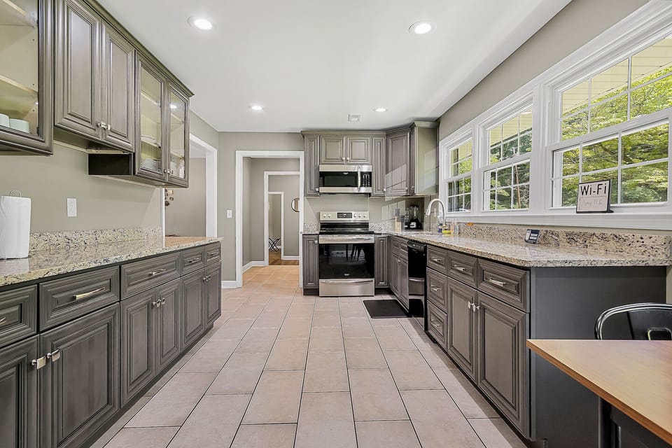 This fully loaded kitchen offers a functional layout with full-size appliances, ample counter space, and everything needed to prepare meals with ease during your stay.