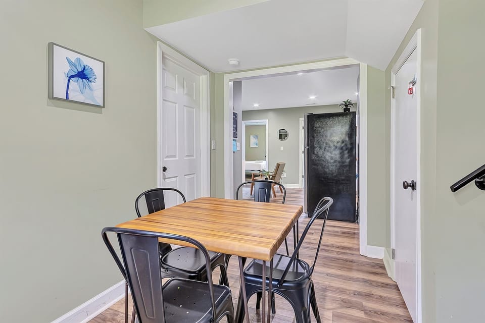 The dining space is simple and functional, with seating for four and a layout that works just as well for meals as it does for catching up, working, or planning your day.