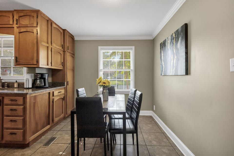 Gather around the dining table just off the kitchen with seating for six—perfect for meals, morning coffee, or late-night chats after a full day.