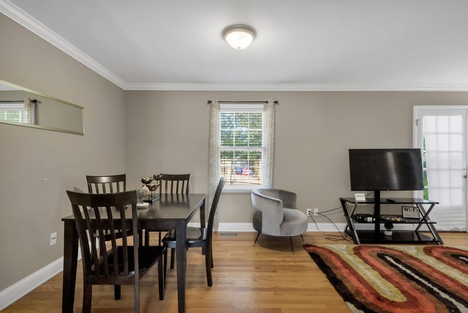 Relax in the cozy living room with comfortable seating for everyone—perfect for movie nights, conversations, or catching the game. There is an extra dining table that seats four.