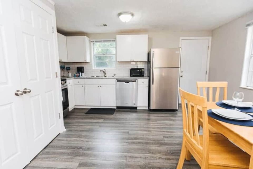 From the dining area, the kitchen feels open and connected, making it easy to move between cooking, serving, and spending time together.