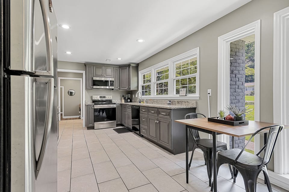 Bright breakfast nook just off the kitchen, perfect for slow mornings with coffee or quick bites before heading out. A simple, cozy spot that keeps you connected to the heart of the home.