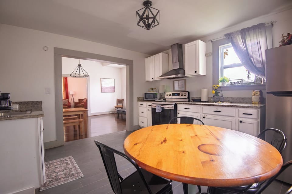 The kitchen and dining area flow together, making it easy to cook, chat, and enjoy time together without missing a conversation.