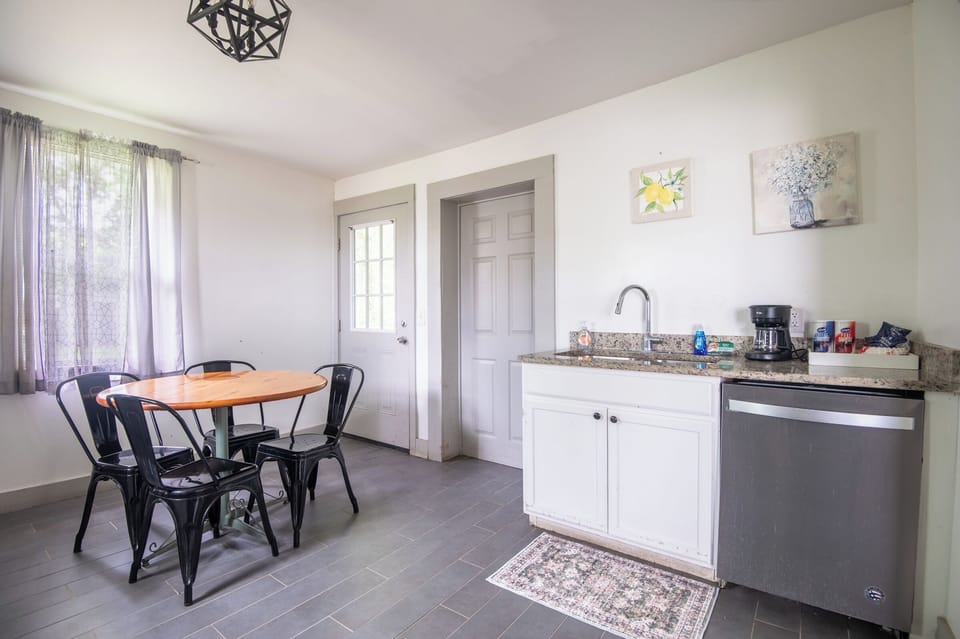 Whether you're brewing your morning coffee or sharing a homemade meal, this bright kitchen makes every part of your stay feel a little more comfortable.