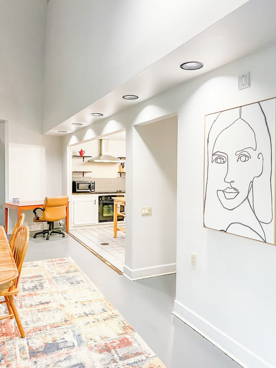A convenient workspace tucked between the kitchen and dining area offers a simple spot to check emails, plan your day, or get a little work done without missing the action.