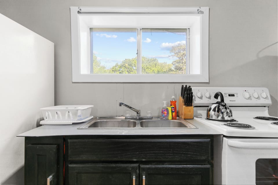 Everything within reach—cook, sip your coffee, and stay connected with a kitchen setup designed for easy, everyday living.