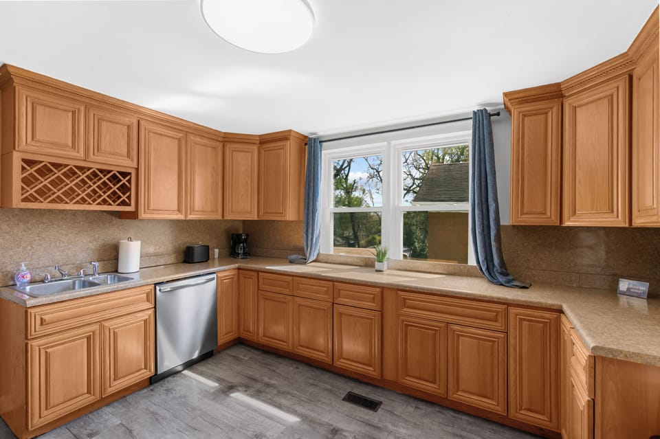 With extensive cabinet storage and room to spread out, this kitchen is both functional and comfortable for everyday use. Stainless appliances and a dishwasher included!