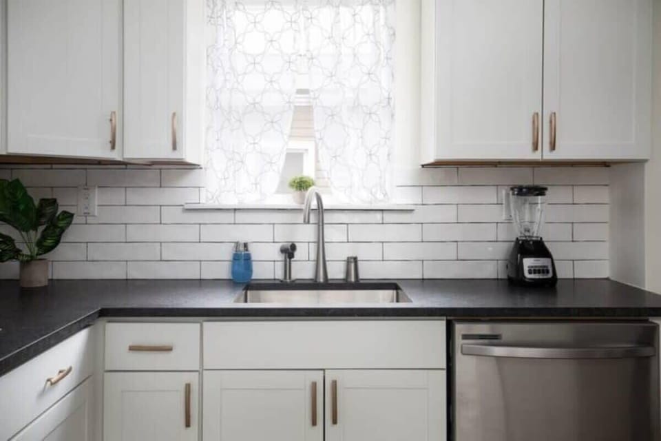 This bright kitchen pairs modern stainless appliances with a functional layout, making it easy to prep, cook, and gather.