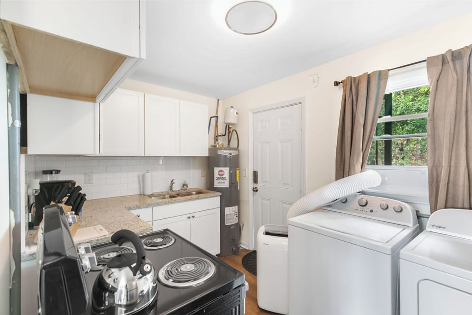 Flat No. 6 does feature a washer and dryer in the kitchen area for longer stays