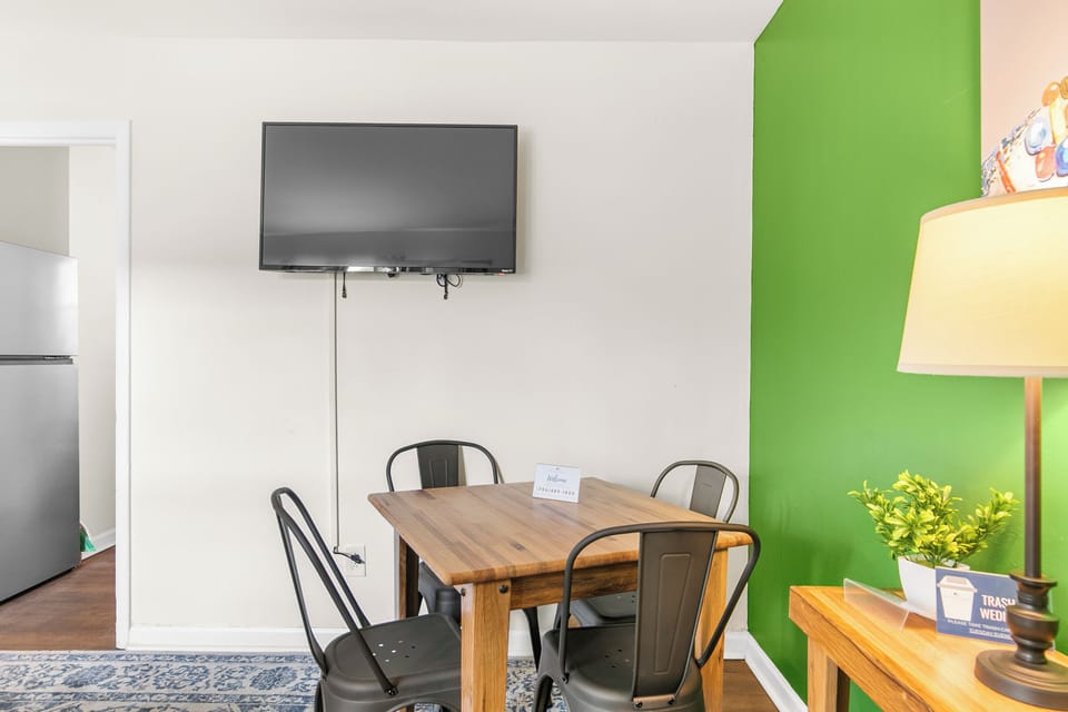 Tucked into the corner of the living space, the dining table for four gives you a spot to sit down for a meal or catch up over coffee.