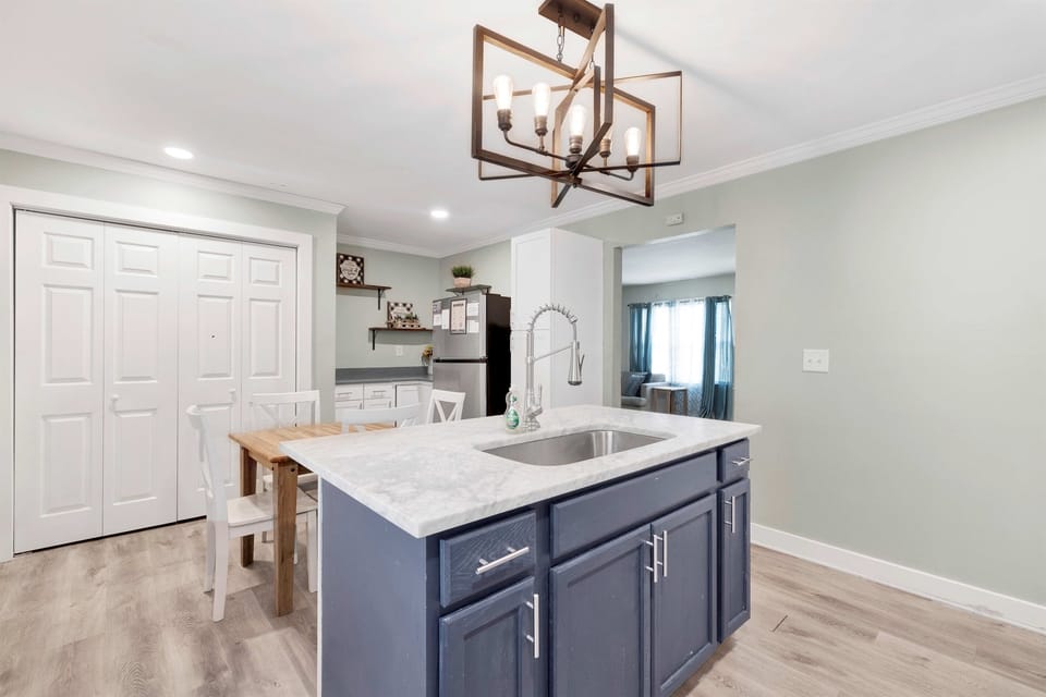 Prep, rinse, and connect at the island sink while the dining table sits just within view—keeping every moment of cooking and gathering seamlessly connected.