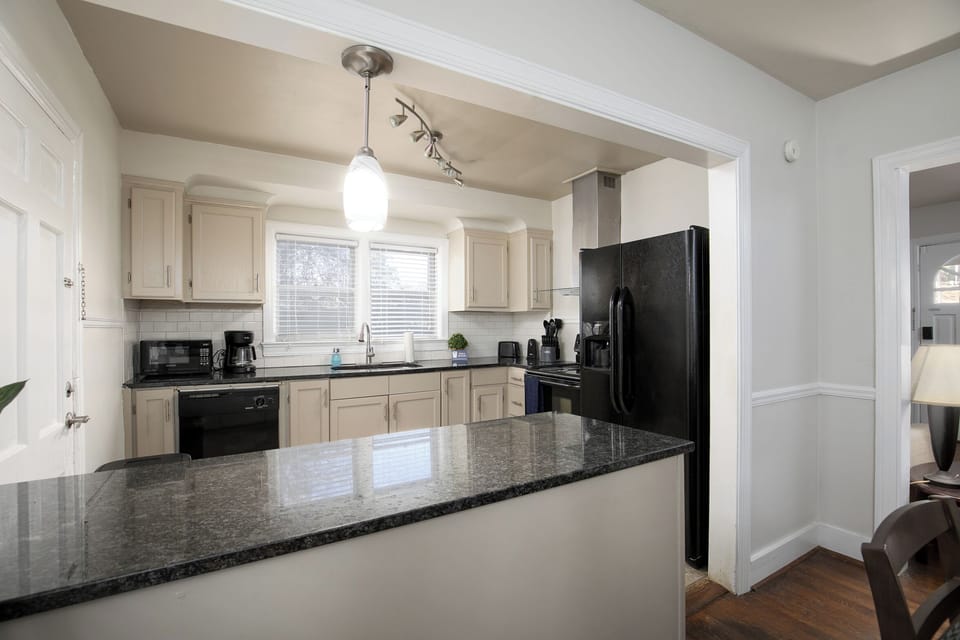Another look at the kitchen, where clean finishes and an open layout make cooking feel easy and inviting