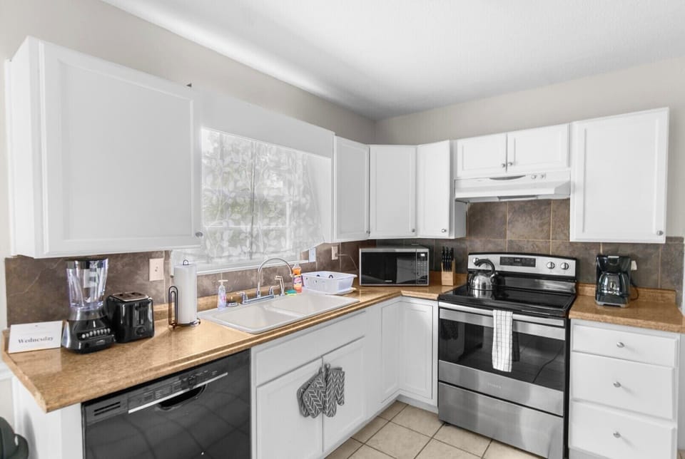 Start your mornings here with a fresh cup of coffee and a quiet moment before the day begins. With a clean, modern layout, this kitchen makes everyday routines feel easy and inviting.