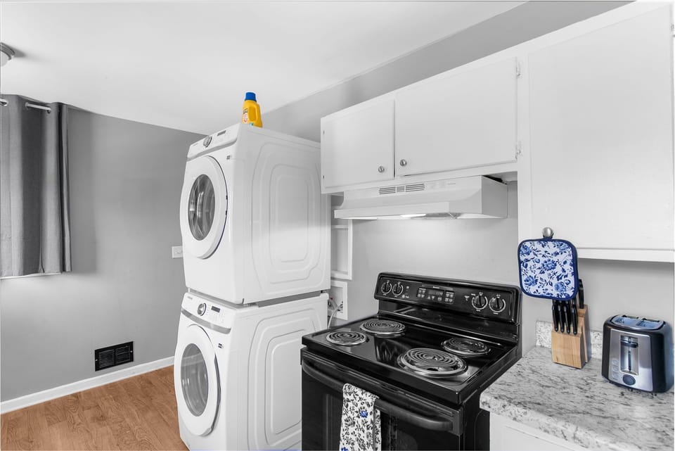 Bonus convenience—laundry is tucked right into the kitchen area, making longer stays easy and stress-free.