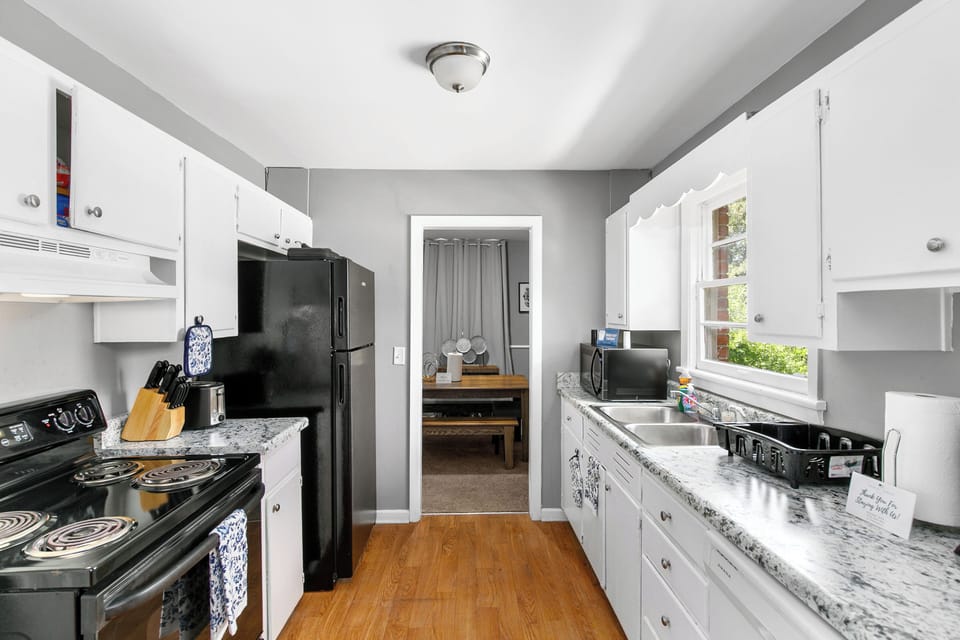 Bright and functional, the kitchen makes it easy to prep, serve, and stay connected with the rest of the space.