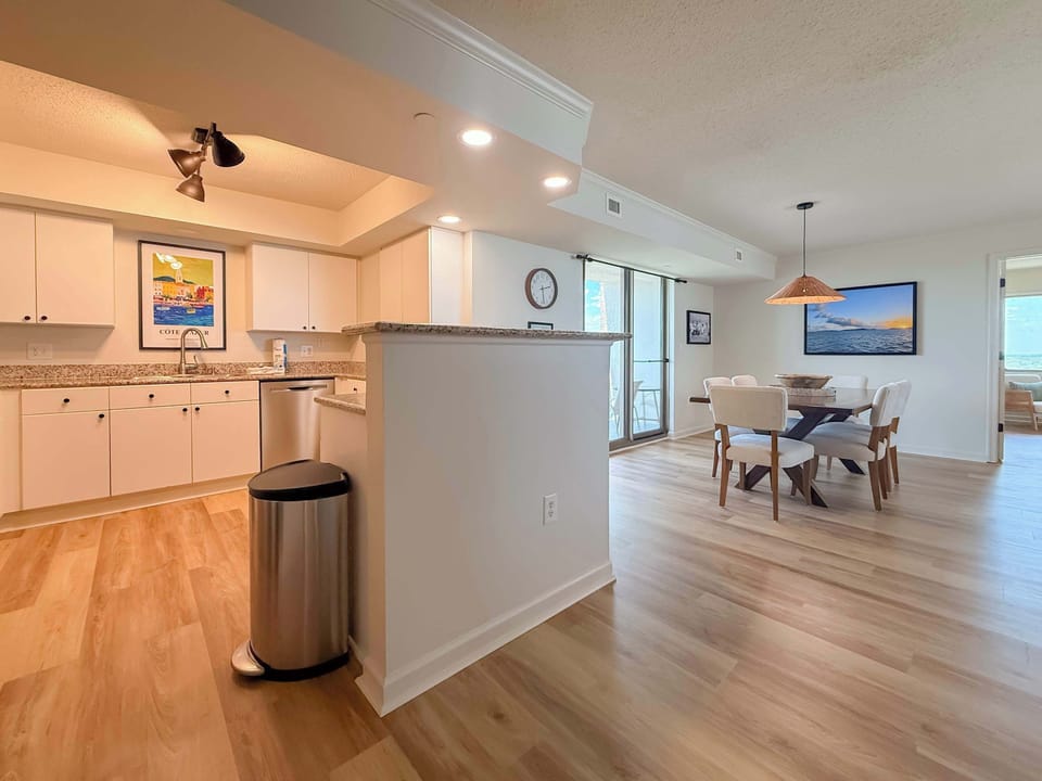 Open layout keeps the cook connected to the dining and living areas.