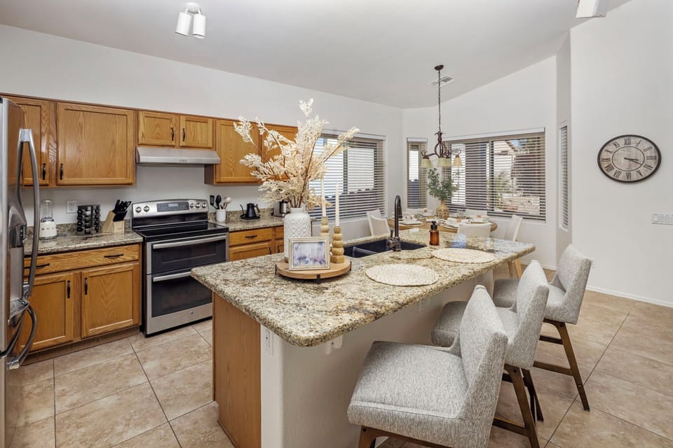 Open kitchen with island seating perfect for snacks and drinks.