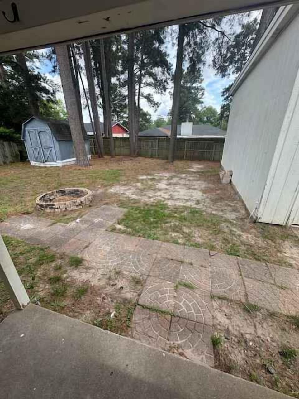 fully fenced back yard w firepit