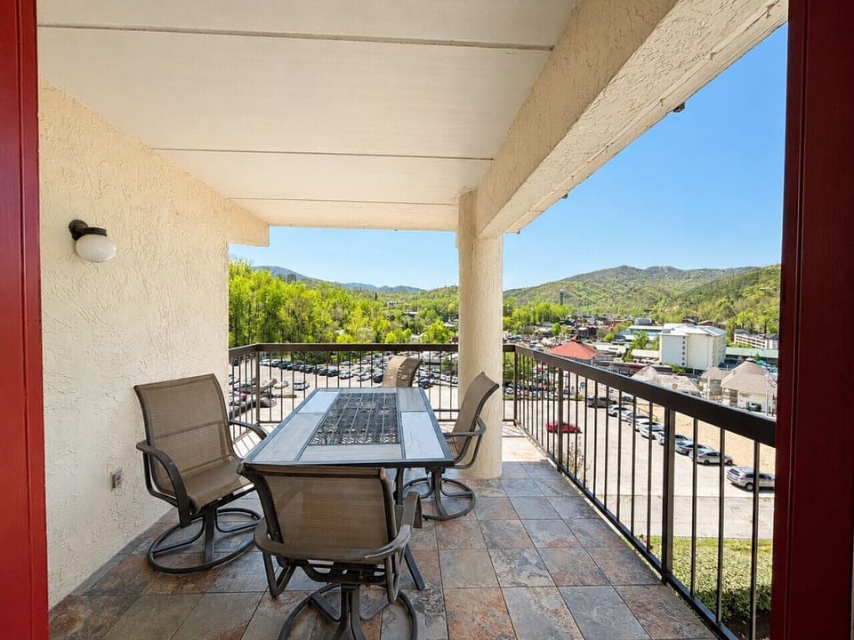 Enjoy morning coffee or evening meals on your private balcony overlooking downtown Gatlinburg and the surrounding Smoky Mountains.