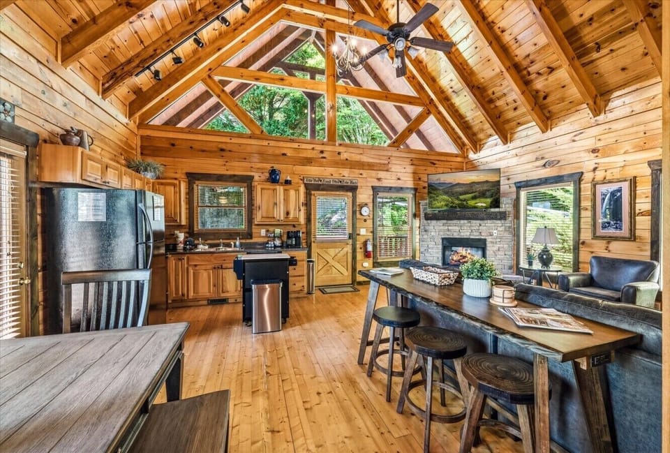 Soaring vaulted ceilings, exposed wood beams, and an open layout create a bright and inviting space designed for group gatherings.