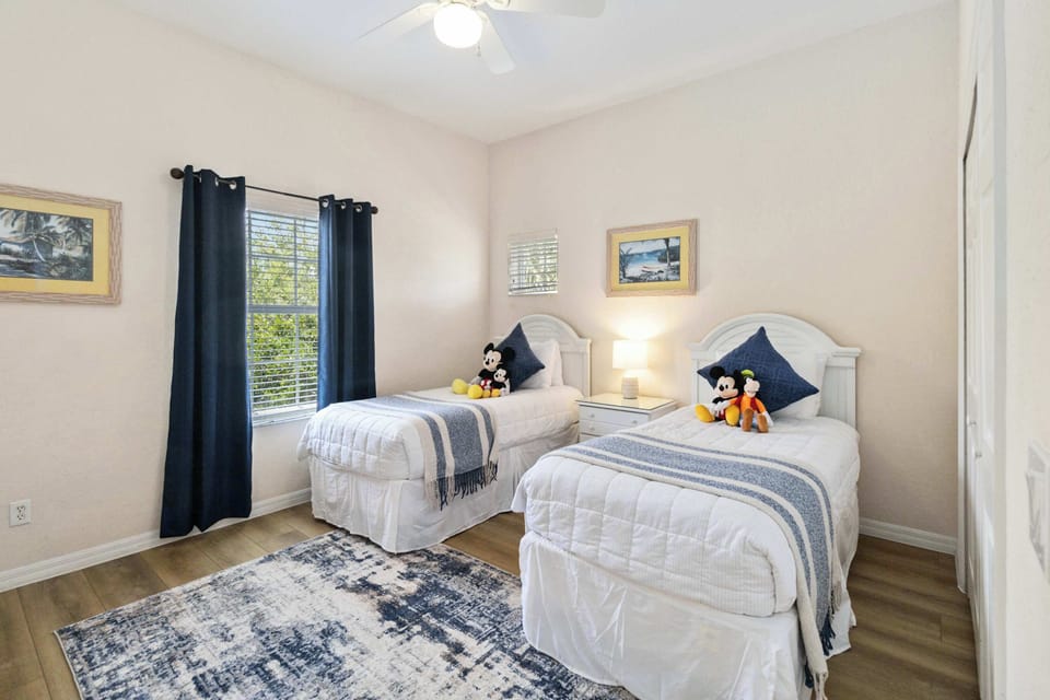 Bedroom 2 with 2 twin beds and TV